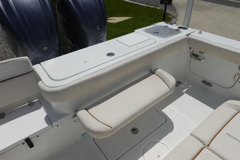 Slide: The Image of 2022 Sea Hunt Gamefish 27 Coffin Box boat interior with seating and dual engines. - 6
