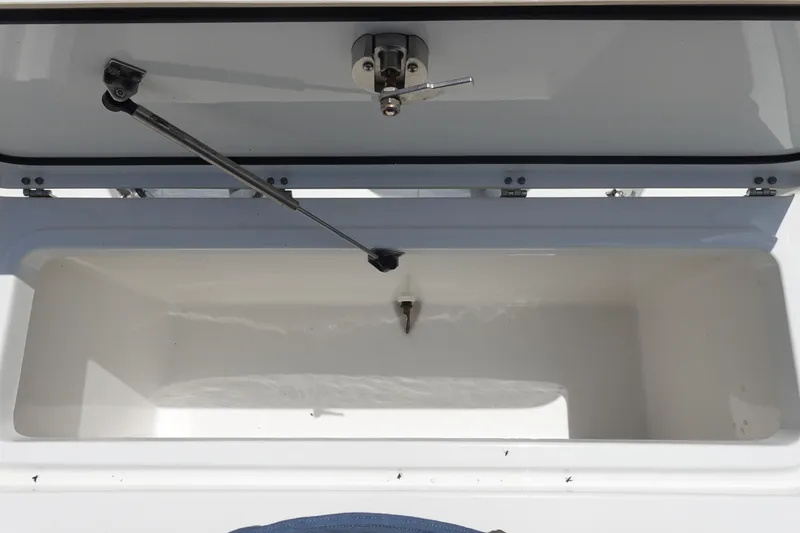 Slide: The Image of Open coffin box on 2022 Sea Hunt Gamefish 27 boat, showcasing interior storage space. - 8