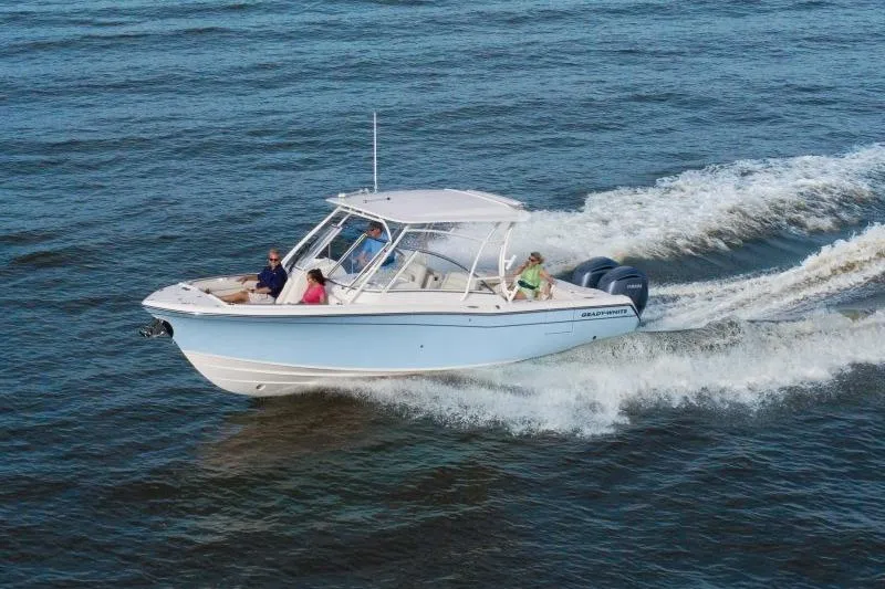 Slide: The Image of 2027 Grady-White Freedom 285 boat cruising on open water with passengers. - 1