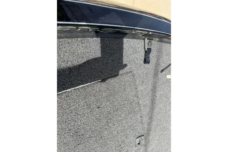 Slide: The Image of 2022 Ranger Z520R Cup-Equipped boat interior with carpeted surface and latch detail. - 103