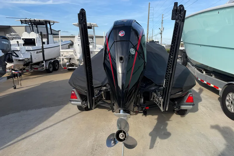 Slide: The Image of 2022 Ranger Z520R Cup-Equipped boat with powerful outboard motor, parked in a marina. - 116