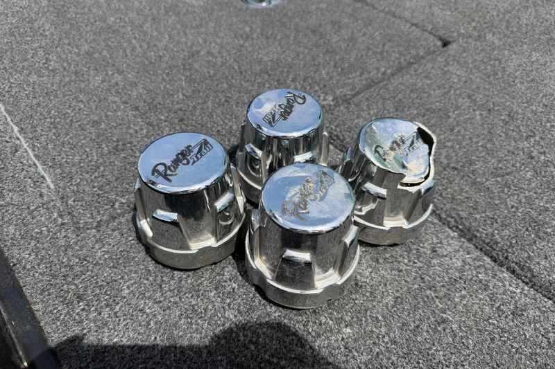 Slide: The Image of Four chrome Ranger Z520R hubcaps on a textured surface, 2022 model. - 16