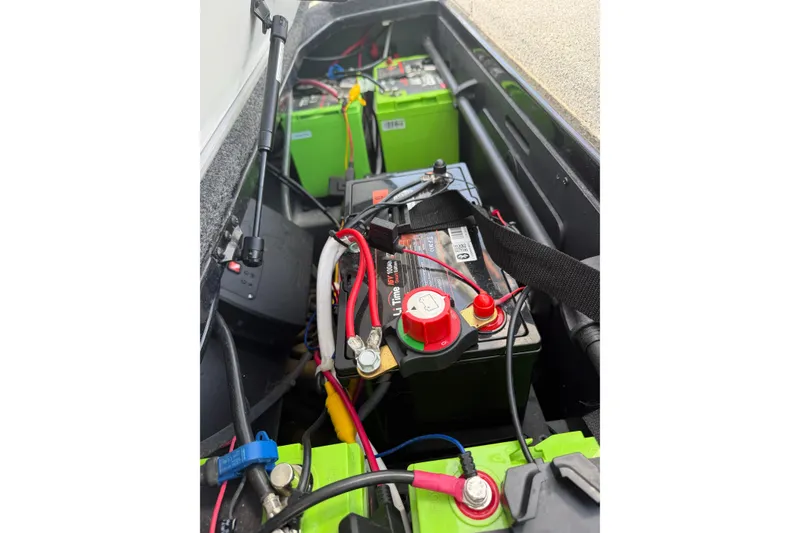 Slide: The Image of 2022 Ranger Z520R Cup-Equipped boat battery compartment with wiring and connections. - 21