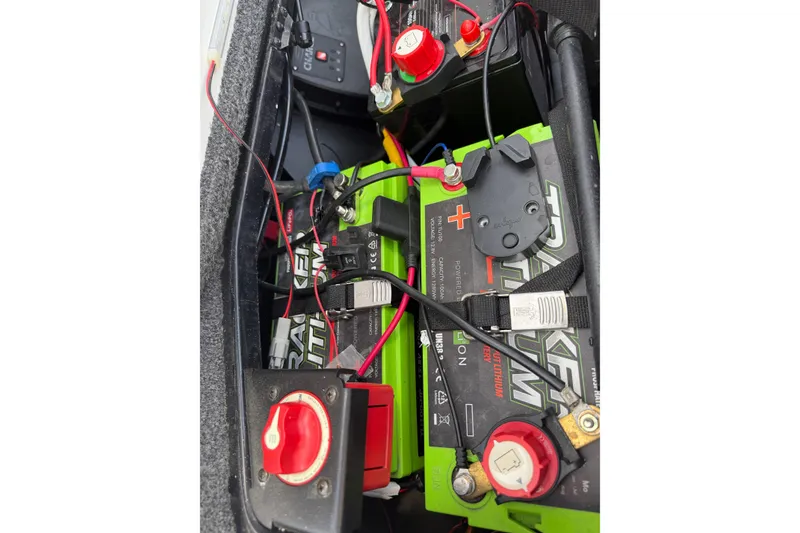 Slide: The Image of Battery compartment of 2022 Ranger Z520R Cup-Equipped boat with wiring and switches. - 23