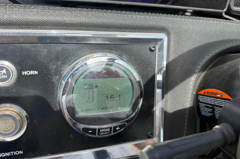 Slide: The Image of Dashboard of 2022 Ranger Z520R Cup-Equipped boat showing trim settings and controls. - 28