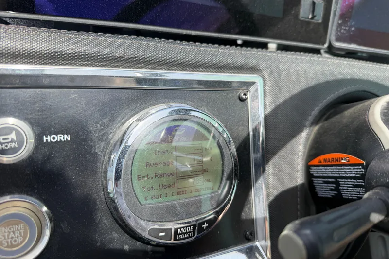 Slide: The Image of Dashboard of 2022 Ranger Z520R Cup-Equipped boat showing digital display and controls. - 33