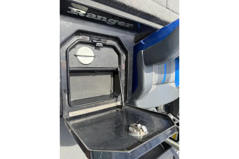 Slide: The Image of 2022 Ranger Z520R Cup-Equipped storage compartment with open lid and seating detail. - 39