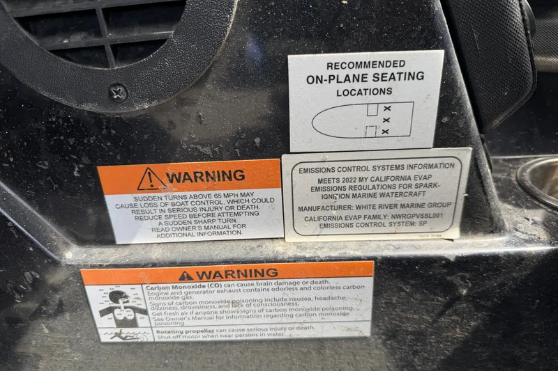 Slide: The Image of Warning labels on a 2022 Ranger Z520R Cup-Equipped boat, highlighting safety and emissions information. - 41