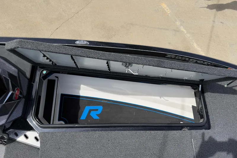 Slide: The Image of 2022 Ranger Z520R Cup-Equipped boat storage compartment with open lid. - 48