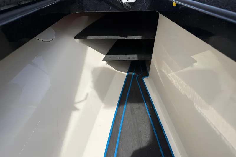 Slide: The Image of Interior view of 2022 Ranger Z520R Cup-Equipped boat with sleek design and blue accents. - 50