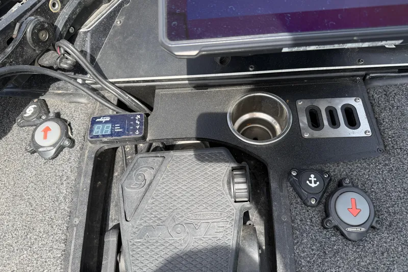 Slide: The Image of 2022 Ranger Z520R Cup-Equipped boat dashboard with controls, cup holder, and digital display. - 58