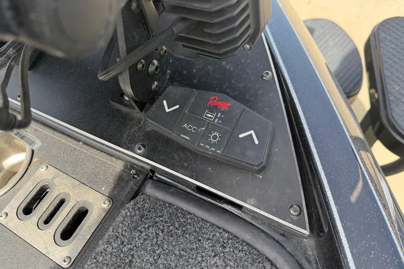 Slide: The Image of Control panel of 2022 Ranger Z520R Cup-Equipped boat with adjustment buttons. - 59
