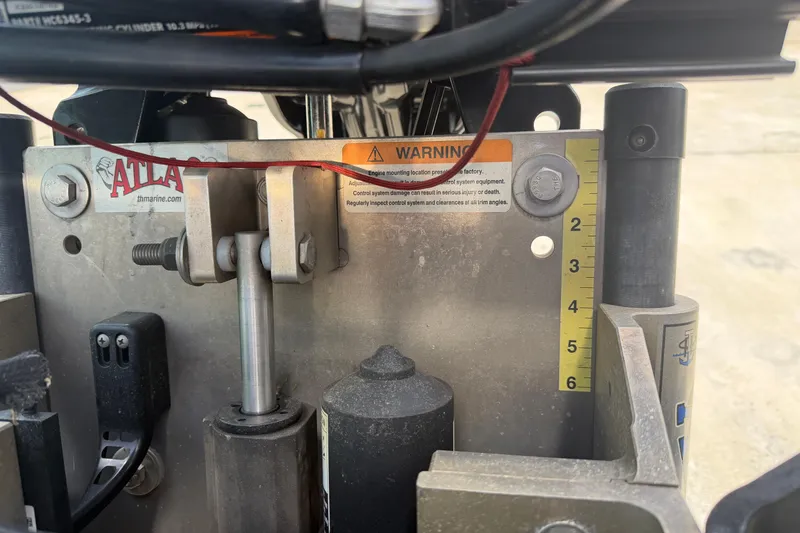 Slide: The Image of Close-up of 2022 Ranger Z520R Cup-Equipped boat engine mount with warning label and measurement scale. - 6