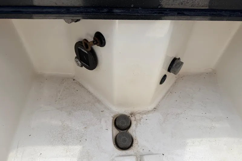 Slide: The Image of 2022 Ranger Z520R Cup-Equipped boat interior with drainage and plug details. - 68