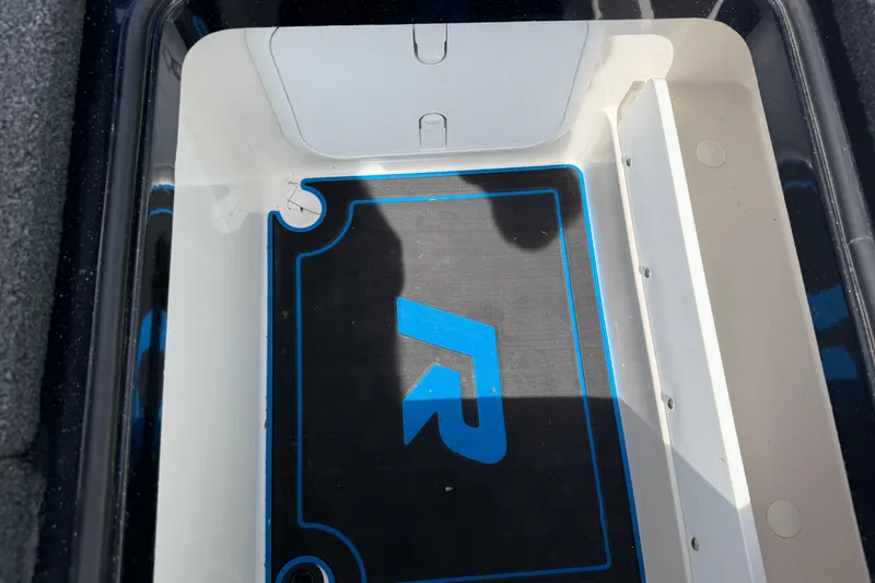 Slide: The Image of 2022 Ranger Z520R Cup-Equipped boat storage compartment with logo and blue accents. - 70
