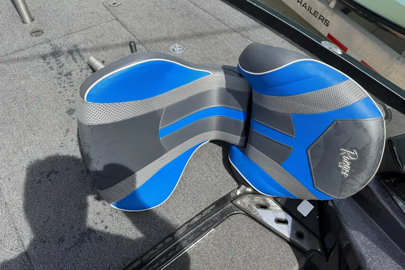 Slide: The Image of 2022 Ranger Z520R Cup-Equipped boat seat, blue and gray design, on deck. - 75