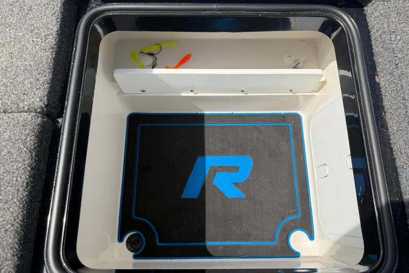 Slide: The Image of Storage compartment of 2022 Ranger Z520R Cup-Equipped boat with fishing lures inside. - 88