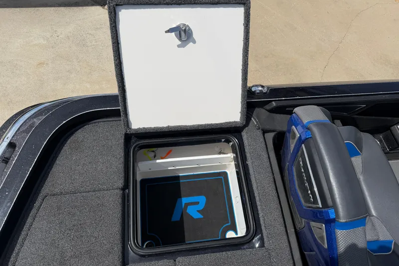 Slide: The Image of Open storage compartment in 2022 Ranger Z520R Cup-Equipped boat. - 89