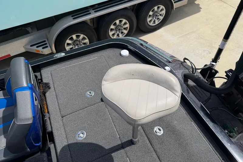 Slide: The Image of 2022 Ranger Z520R Cup-Equipped boat interior with seating and storage compartments. - 90