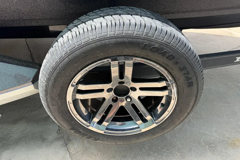 Slide: The Image of 2022 Ranger Z520R Cup-Equipped trailer tire with Load Star branding and chrome rim. - 92