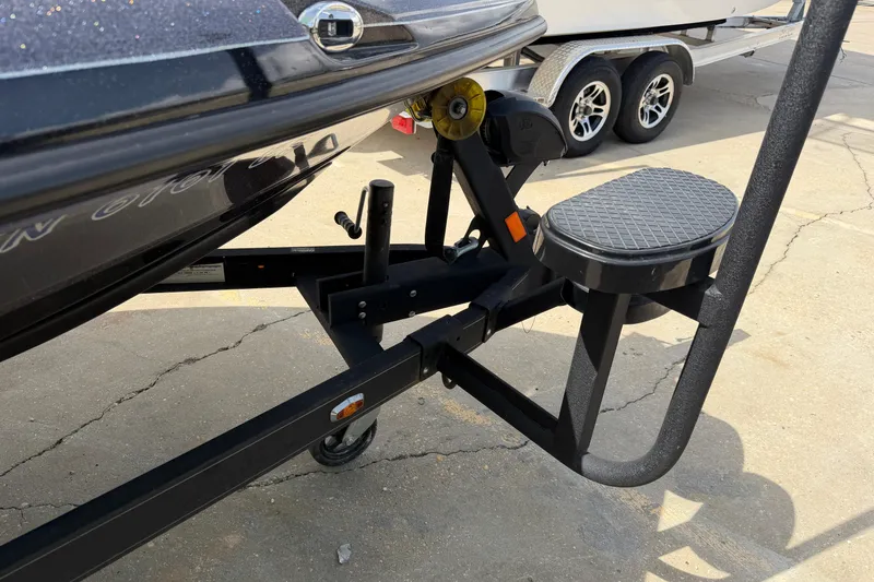 Slide: The Image of 2022 Ranger Z520R Cup-Equipped boat trailer with step and winch on concrete surface. - 95