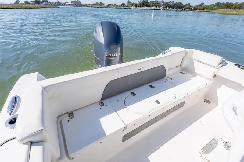 Slide: The Image of 2021 Tidewater 220 LXF boat with Yamaha 200 engine on calm water. - 15