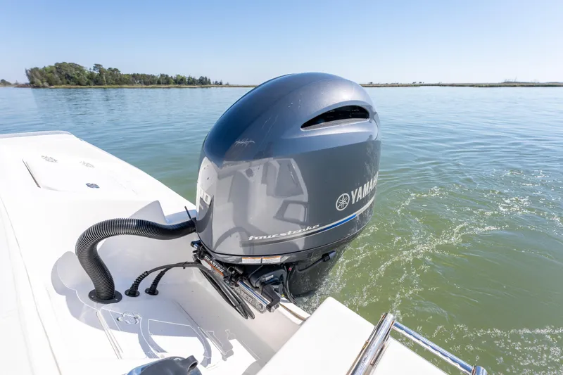 Slide: The Image of 2021 Tidewater 220 LXF boat with Yamaha outboard motor on calm water. - 17