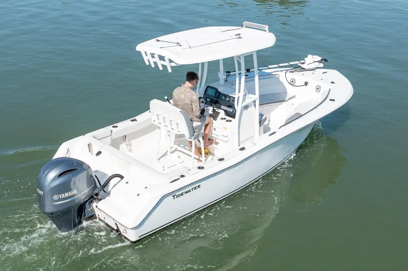 Slide: The Image of 2021 Tidewater 220 LXF boat cruising on calm water with Yamaha engine. - 3