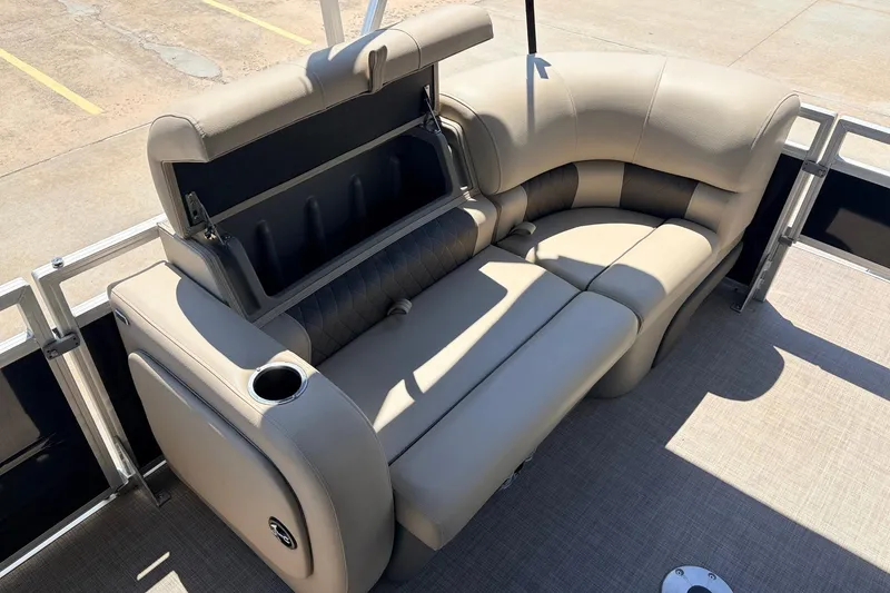 Slide: The Image of 2024 Sun Tracker SportFish 22 XP3 pontoon boat with plush seating and storage compartment. - 12