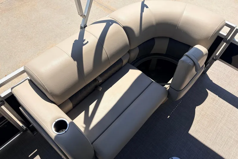 Slide: The Image of 2024 Sun Tracker SportFish 22 XP3 boat seating with cup holder, beige upholstery. - 14