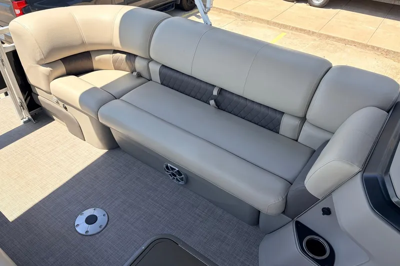 Slide: The Image of 2024 Sun Tracker SportFish 22 XP3 boat interior with plush seating and modern design. - 18