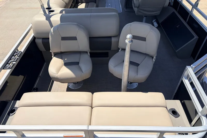 Slide: The Image of 2024 Sun Tracker SportFish 22 XP3 interior with beige seating and fishing rod holder. - 45
