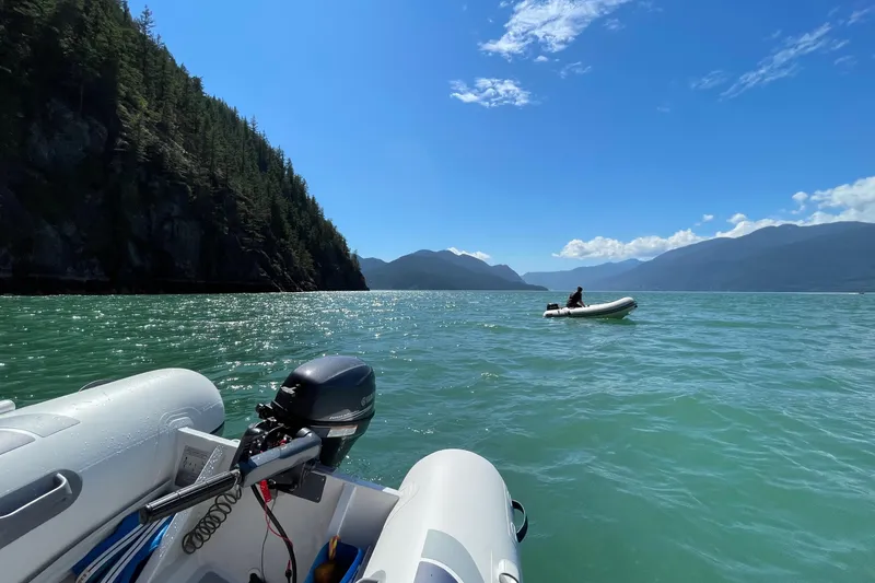 Slide: The Image of Highfield UltraLite 290 boat on scenic lake with mountains, 2026 model. - 7