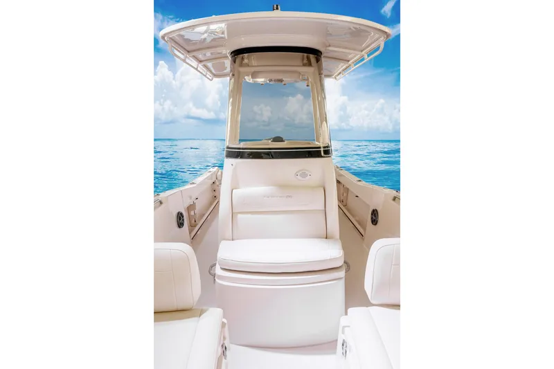 Slide: The Image of 2027 Grady-White Fisherman 216 boat interior with ocean view, showcasing seating and helm. - 10