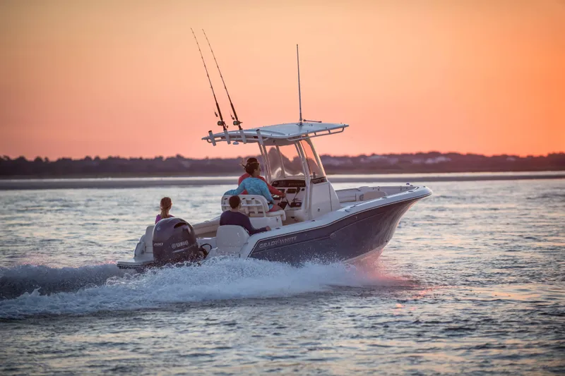 Slide: The Image of 2027 Grady-White Fisherman 216 boat cruising at sunset on calm waters. - 3