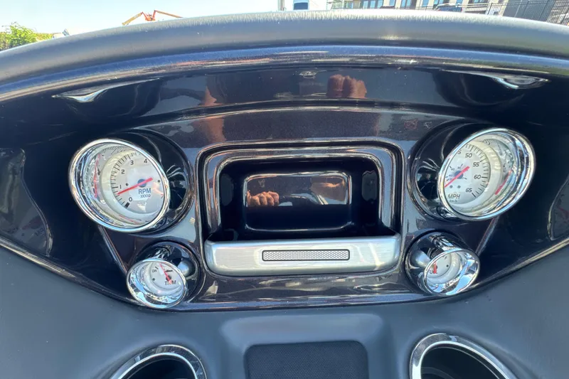 Slide: The Image of Dashboard of a 2022 Ranger 223FC boat with gauges and controls. - 17