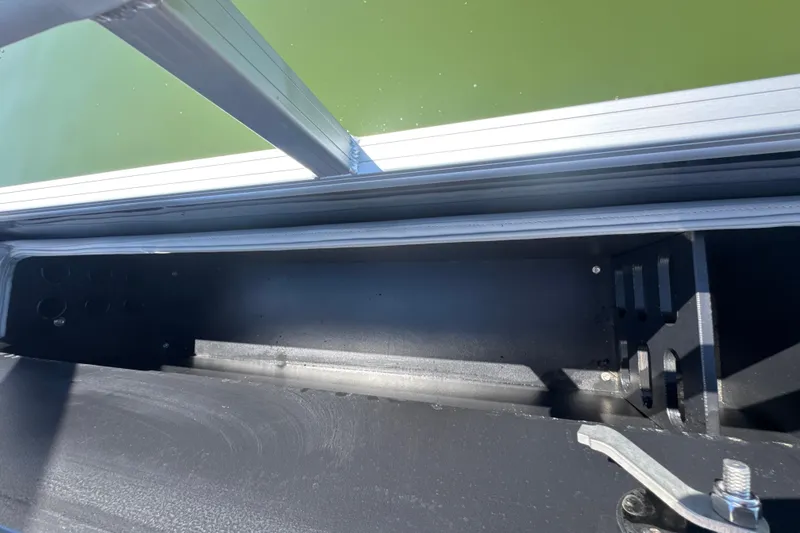 Slide: The Image of Interior view of a 2022 Ranger 223FC boat compartment with metal framing. - 24