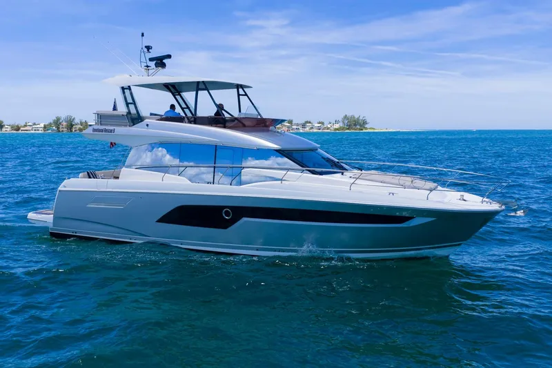 Slide: The Image of 2022 Prestige 520 yacht cruising on blue ocean waters. - 101