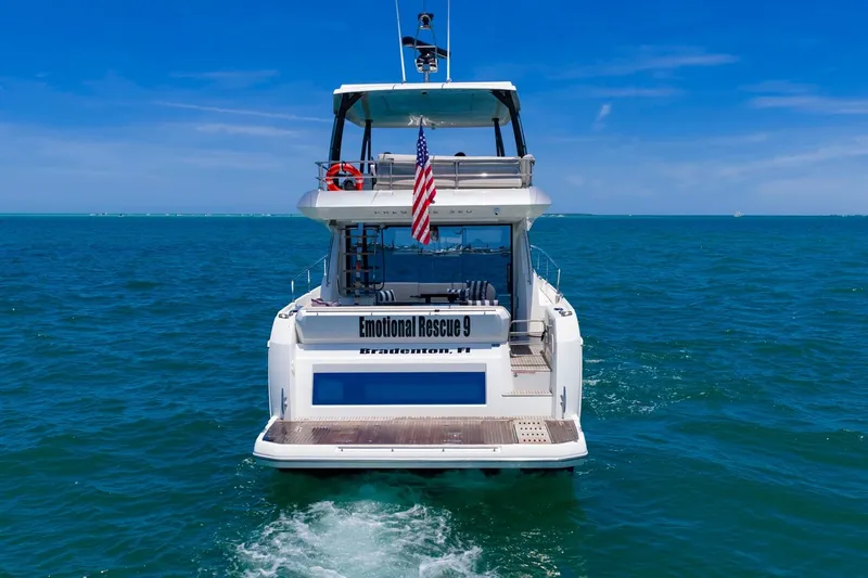 Slide: The Image of Luxury 2022 Prestige 520 yacht cruising in clear blue ocean waters. - 108