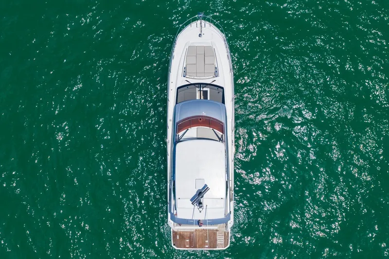 Slide: The Image of Aerial view of 2022 Prestige 520 yacht on vibrant green water. - 109