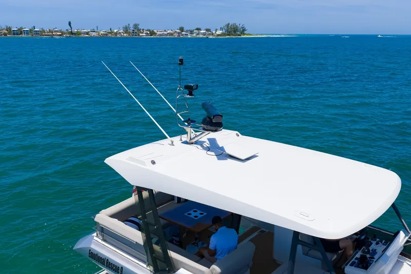 Slide: The Image of Prestige 520 yacht cruising on blue waters, 2022 model, with scenic coastal backdrop. - 112