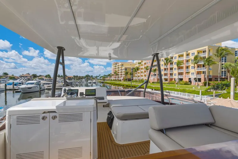 Slide: The Image of Luxurious 2022 Prestige 520 yacht docked at marina with waterfront view. - 19