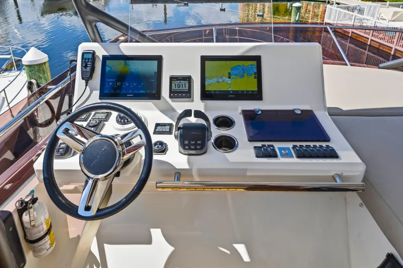 Slide: The Image of Cockpit of 2022 Prestige 520 yacht with modern navigation displays and controls. - 22