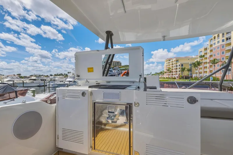 Slide: The Image of Luxury yacht Prestige 520, 2022 model, docked with modern amenities and scenic marina view. - 25
