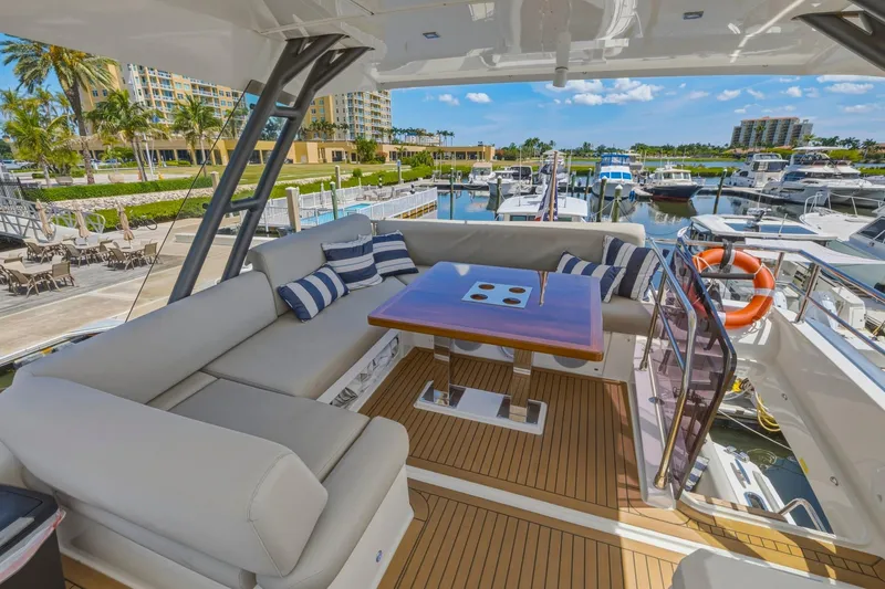 Slide: The Image of Luxurious 2022 Prestige 520 yacht interior with elegant seating and marina view. - 29