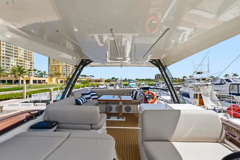 Slide: The Image of Luxurious 2022 Prestige 520 yacht interior at marina, featuring plush seating and modern design. - 33