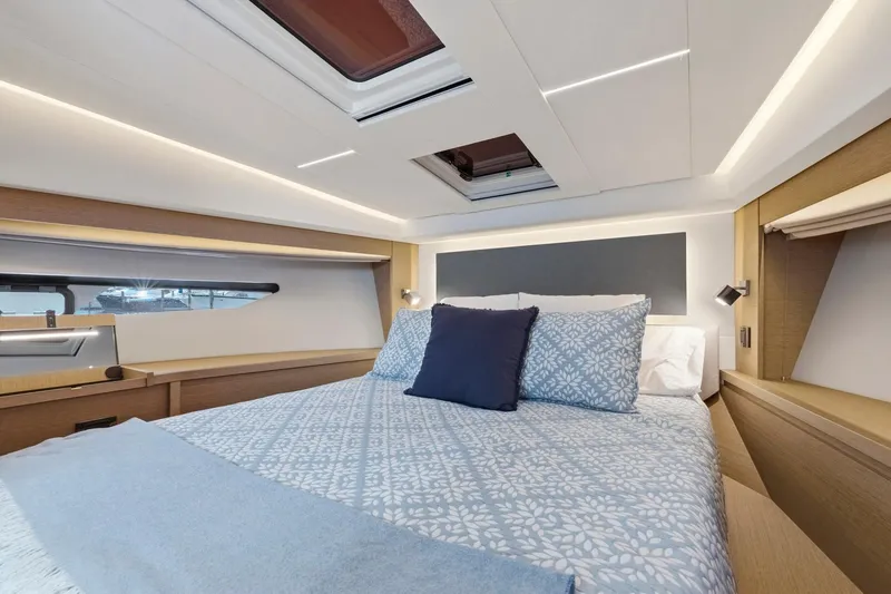 Slide: The Image of Luxurious cabin interior of 2022 Prestige 520 yacht with elegant bedding and modern lighting. - 36