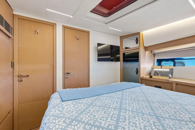 Slide: The Image of Luxurious bedroom interior of 2022 Prestige 520 yacht with modern design and cozy bedding. - 37