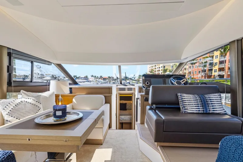Slide: The Image of Luxurious interior of 2022 Prestige 520 yacht with modern seating and elegant decor. - 40