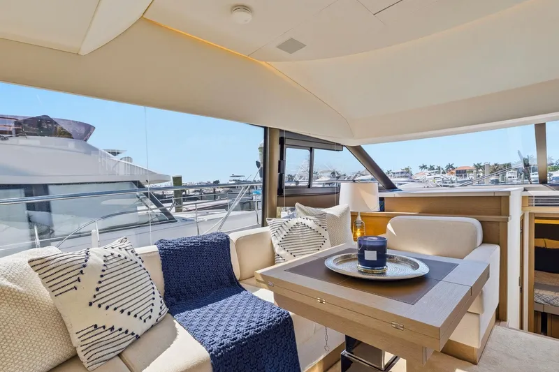 Slide: The Image of Luxurious interior of 2022 Prestige 520 yacht with elegant seating and panoramic windows. - 41